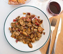 Traditional Spanish Dish Champinones Salteados, Sauteed Mushrooms With Fried Bacon