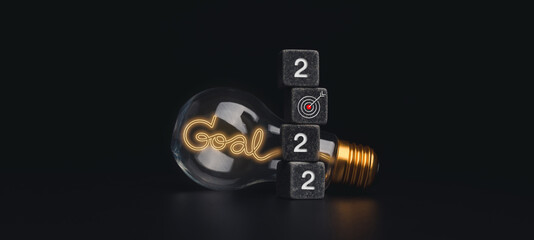 Poster - 2022 Happy New year banner with goal and success concept. The 2022 numbers on black dice stack, target icon and light bulb with neon light style words on dark background, modern and minimal style.