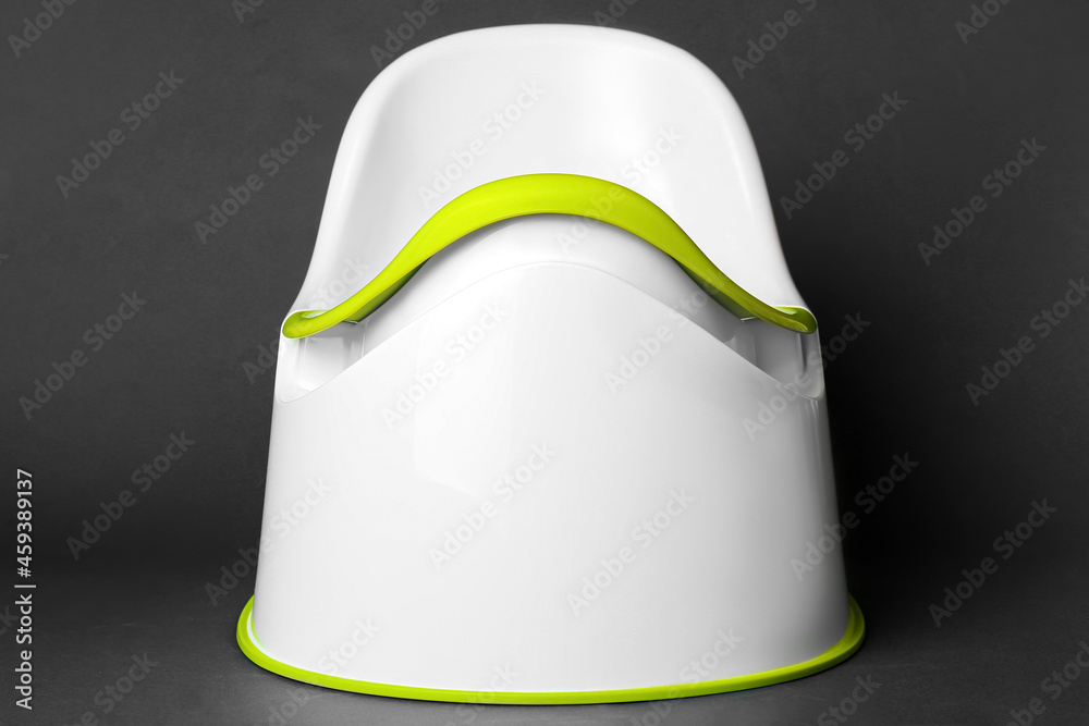 Potty on black background. Toilet training concept
