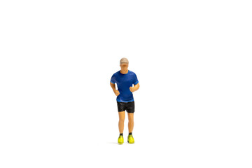 Miniature people, Man in fitness wear running on white background and space for text