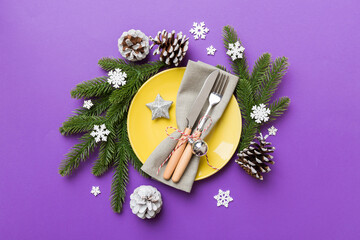 Sticker - Christmas table place setting with christmas decor and plates, kine, fork and spoon. Christmas holiday background. Top view with copy space