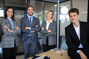 Poster - Group of successful business people on the background of the office.