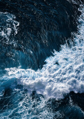 Wall Mural - Aerial view to waves in ocean Splashing Waves. Blue clean wavy sea water.