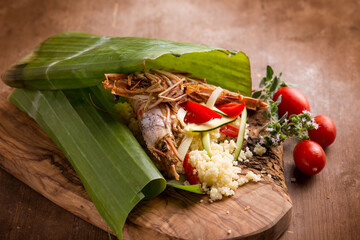 Poster - shrimp coucous with zucchinis cooked on banana leaf