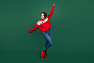 Poster - Full length body size view of attractive cheerful ecstatic girl dancing rest enjoying isolated over green color background