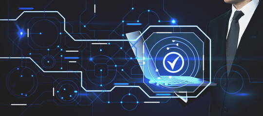 Poster - Close up of businessman using laptop with abstract glowing digital business circuit network and tick mark interface on blurry background. Technology, choice and completion concept. Double exposure.