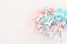 Creative Image Of Pastel Blue And Pink Hydrangea Flowers On Artistic Ink Background. Top View With Copy Space