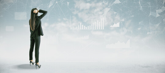 Poster - Back view of attractive young european woman in suit standing on abstract blue sky with clouds background with business chart and graph. Finance, training, workshop and success concept.