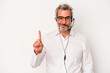 © Asier - Middle age telemarketer caucasian man isolated on white background  showing number one with finger.