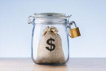 Money For Emergency Fund In The Glass Jar. Concept Financial Security.