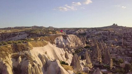 Sticker - An aerial drone shot of the old high castle with the Turkish flag at sunset in Capadoccia, Turkey