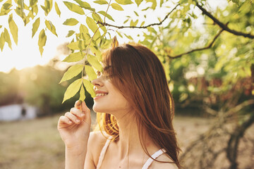 Wall Mural - attractive woman outdoors green leaves nature field