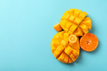 Ripe Mango And Orange On Blue Background