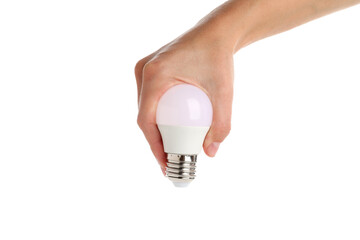 Wall Mural - Female hand holds energy saving bulb, isolated on white background