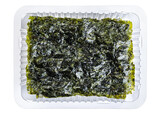 Fototapeta  - Crispy nori seaweed korean snack in a plastic container isolated on white background. With clipping path.