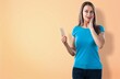 © BillionPhotos.com - Dreamy young pretty woman holds mobile phone
