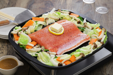 Wall Mural - Japanese cooking; Hokkaido style salmon chanchan yaki, stir fried salmon and vegetables, seasoned with miso sauce.