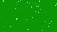 Falling shaped snowflakes on a green background. Christmas motion graphic video animation. Chroma key wallpaper