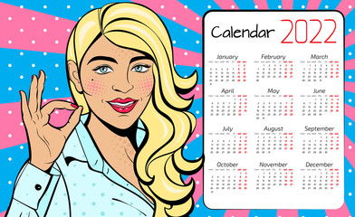 Wall Mural - A calendar for 2022 in the style of pop art with a sexy woman with squinted eyes and open mouth. Background in comic style retro pop art.