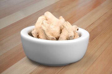 Poster - Fingerroot with finger root herbal powder in ceramic mortar on the desk