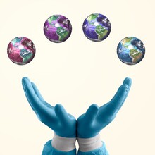 Creative Art Collage. Human Hands Holding Four Colored Images Of Our Planet