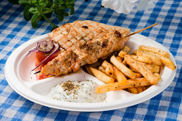 Sticker - Greek souvlaki with pita bread and vegetables close-up on the table