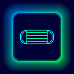 Sticker - Glowing neon line Medical protective mask icon isolated on black background. Colorful outline concept. Vector