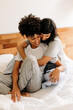 © (JLco) Julia Amaral - Lesbian couple bonding at home