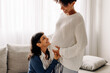 © (JLco) Julia Amaral - Pregnant lesbian couple smiling at each other