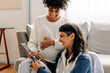 © (JLco) Julia Amaral - Excited lesbian couple looking at their ultrasound scan