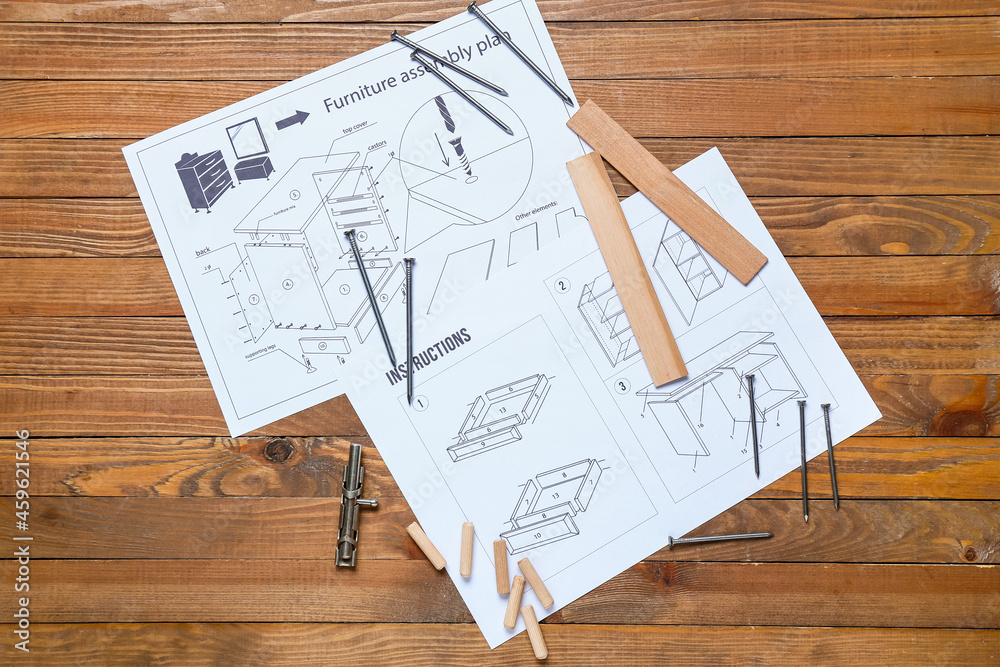 Furniture assembling plan, instructions and tools on wooden background