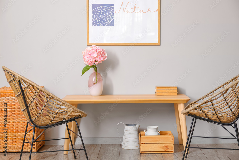 Vase with hydrangea flowers on table in living room