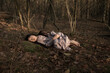 © Milou Dirks - classic portrait of child in dress sleeping in the woods in autumn or winter