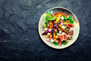 Wall Mural - Fresh salad with plums and figs,space for text