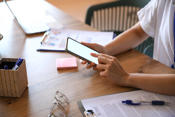 Sticker - Woman using mobile phone at table in office