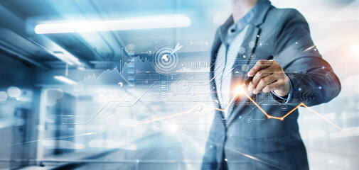 Leinwandbilder - Businessman draw growth graph and progress of business and analyzing financial and investment data ,business planning and strategy on blue background