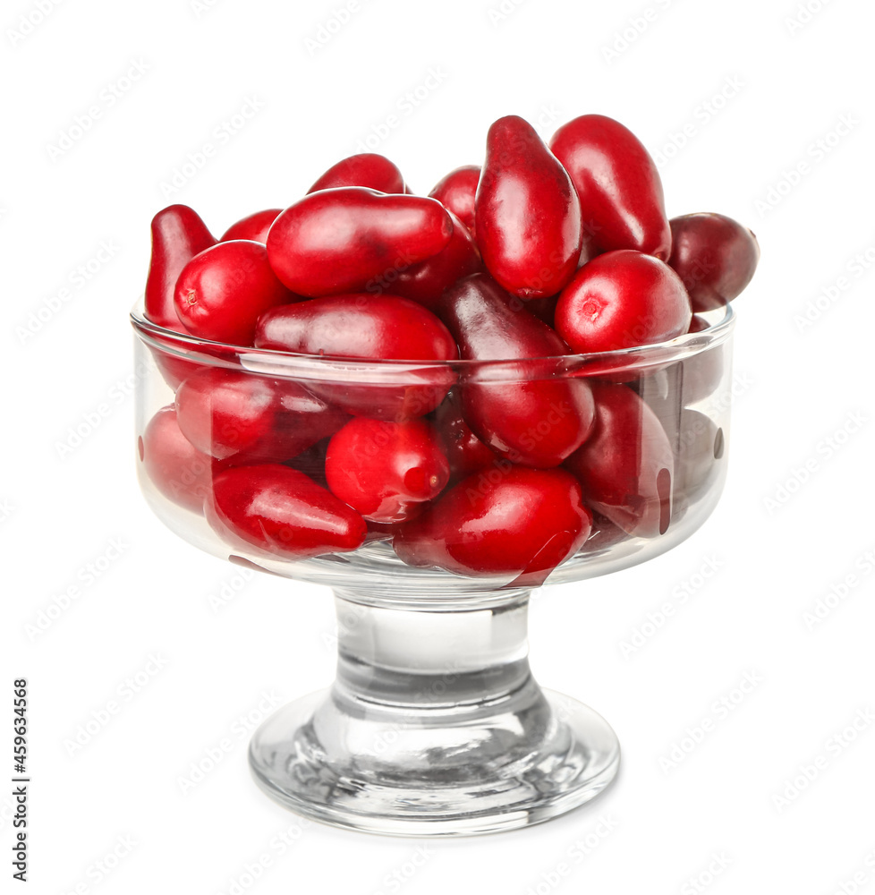 Glass bowl with ripe dogwood berries on white background