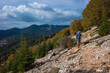 © art_of_line - Hiking on the Lycian Way. Man is trekking on steep stony slope of covered with trees mountain, Trail from Alakilise Ruins to Finike, Outdoor activity, eco tourism in Turkey