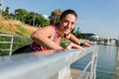 © Westend61 - Beautiful female athlete practicing exercise at railing during sunny day