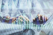 © peshkova - Double exposure of woman hands working on computer and data theme hologram drawing. Tech concept.