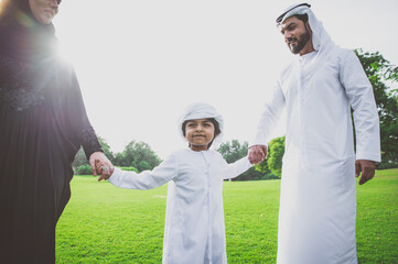 Wall Mural - Happy family spending time together outdoor in Dubai