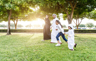 Wall Mural - Happy family spending time together outdoor in Dubai