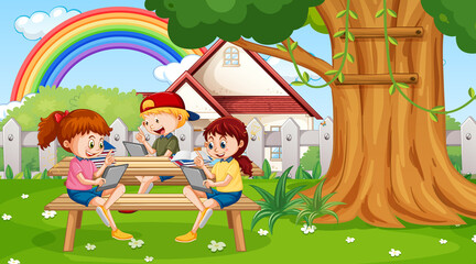 Kids leaning online with tablet in the park