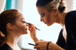 © Westend61 - Woman with spooky make-up preparing friend for Halloween at home