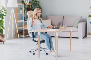 Sticker - Full size photo of focused good mood businesswoman working distance at home typing in laptop drinking coffee pause