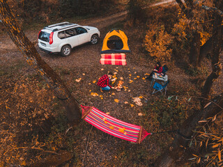 Wall Mural - couple resting near lake camping site