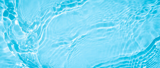 transparent blue clear water surface texture with ripples, splashes and bubbles. abstract summer ban