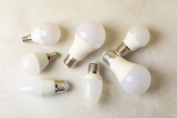 Canvas Print - Energy saving bulbs on white textured background