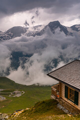 Poster - Wooden Cabin Log in High Alpine Mountains Dramatic Clouds and Storm Weather