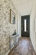 © ADDICTIVE STOCK - Narrow corridor with door at entrance of house